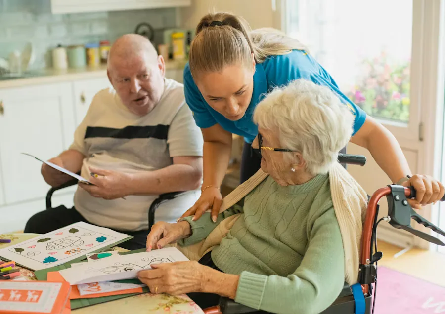 An occupational therapist guiding an elderly client through an activity