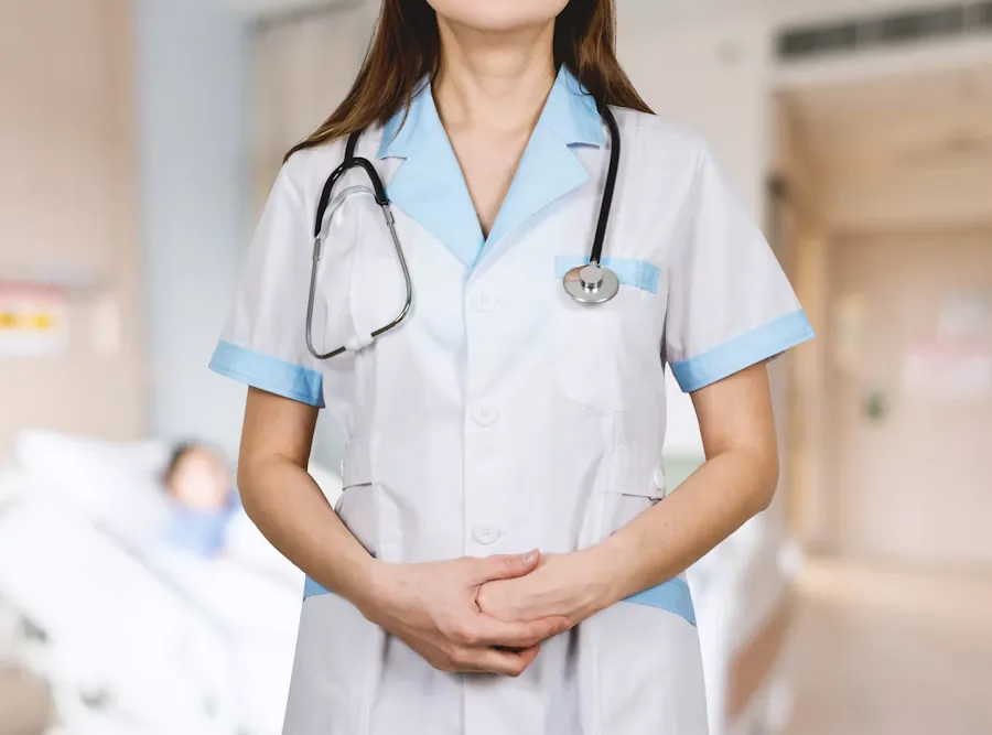 A patient care technician in clinical attire with a stethoscope