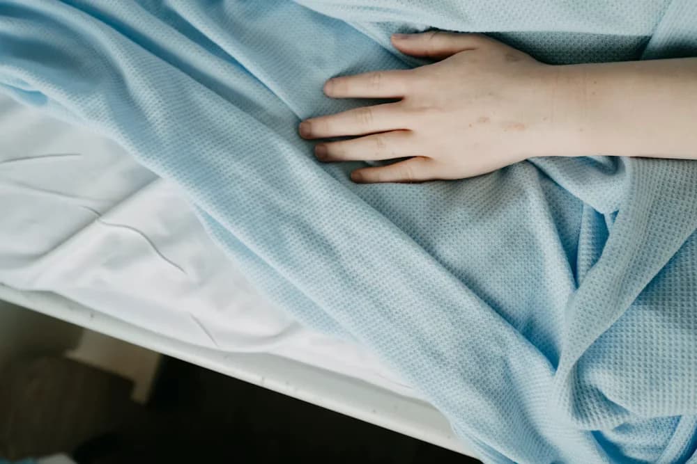 A patient resting comfortably in bed while recovering