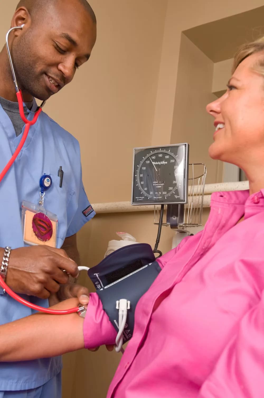 A registered nurse checking a patient's blood pressure